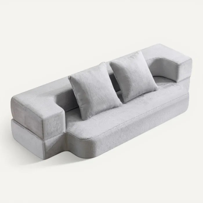 **Technische titel in het Nederlands: Moderne grijze bank met kussens en minimalistisch ontwerp**